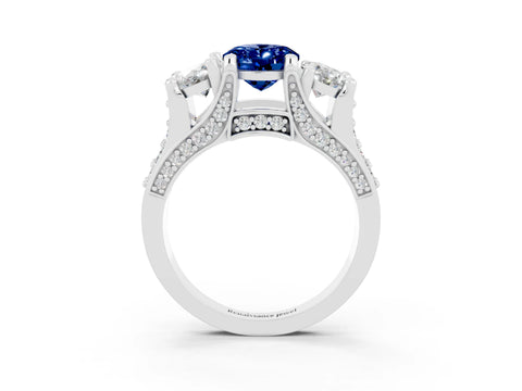 White gold Oval Cut Blue Sapphire Three-Stone Ring with Channel Set Band and Four-Prong Setting_3