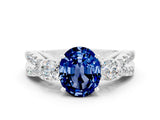 White gold Oval Cut Blue Sapphire Three-Stone Ring with Pavé Split Shank and Four-Prong Setting_12