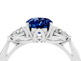 10K White Gold 2.14 Carat Oval Blue Sapphire Three-Stone Ring with Pear Side Stones and Prong Setting