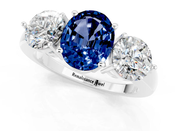 Platinum Oval Cut Blue Sapphire Three-Stone Ring with Prong Setting and Classic Band
