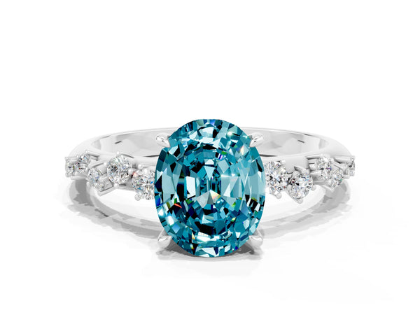 Platinum Oval Blue Topaz Graduated Cluster Solitaire Engagement Ring with Open Basket