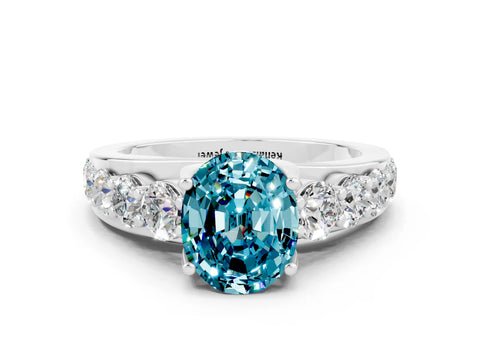 White gold Oval Cut Blue Topaz Engagement Ring with Pavé Band and Four-Prong Setting