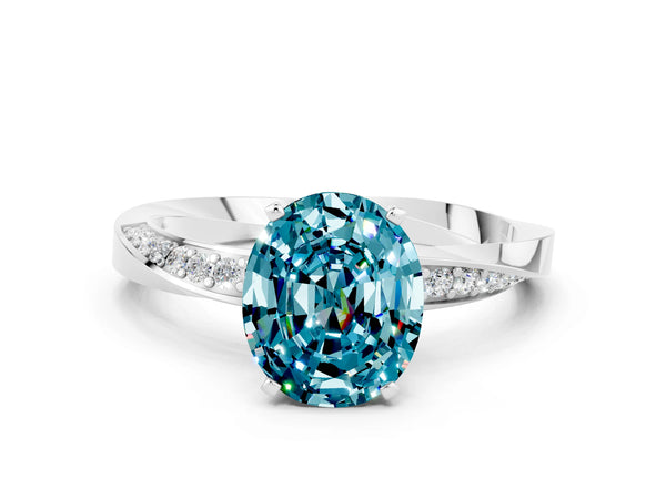 Silver Oval Cut Blue Topaz Engagement Ring with Side Stone Accents and Four-Prong Setting