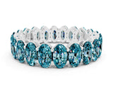 White gold Oval Cut Blue Topaz Eternity Band with Shared Prong Setting