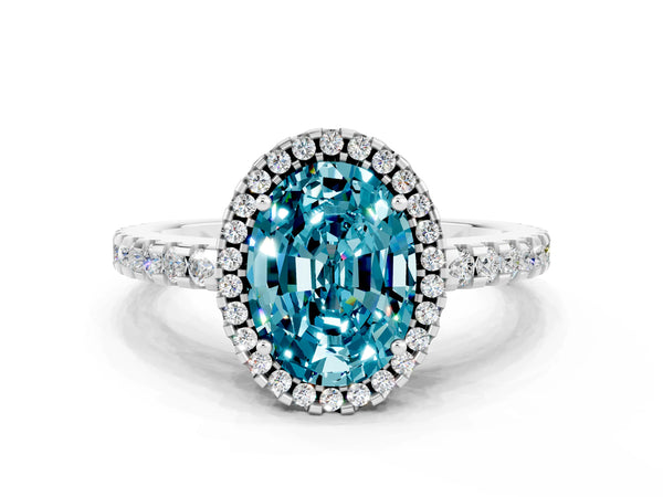 Silver Oval Cut Blue Topaz Halo Engagement Ring with Pavé Band and Prong Setting