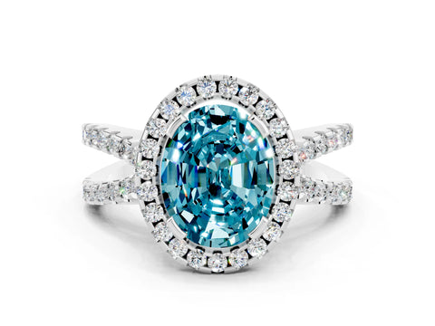 White gold Oval Cut Blue Topaz Halo Ring with Split Shank Pavé Band and Prong Setting
