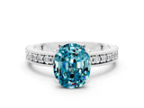 White gold Oval Cut Blue Topaz Milgrain Pavé Engagement Ring with Four-Prong Setting_18