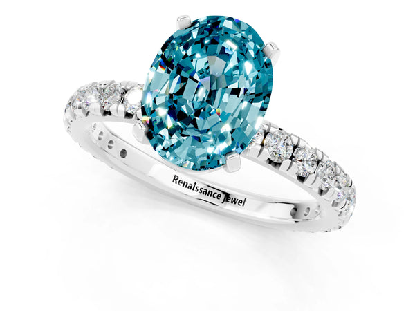 Silver Oval Cut Blue Topaz Pavé Solitaire Ring with Round Band and Prong Setting