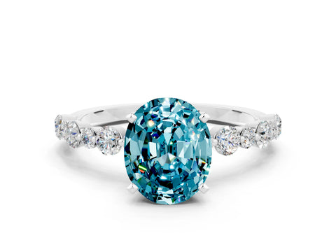 White gold Oval Cut Blue Topaz Prong Set Engagement Ring with Pavé Band