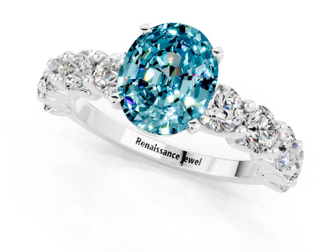 White gold Oval Cut Blue Topaz Prong Setting with Side Stones on a Pave Band_1