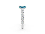 White gold Oval Cut Blue Topaz Prong Setting with Side Stones on a Pave Band_2