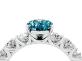 White gold Oval Cut Blue Topaz Prong Setting with Side Stones on a Pave Band_4