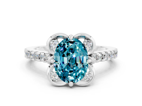 Platinum Oval Cut Blue Topaz Ring with Pavé Band and Floral Prong Setting