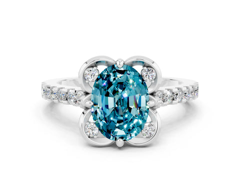 White gold Oval Cut Blue Topaz Ring with Pavé Band and Floral Prong Setting