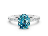 White gold Oval Cut Blue Topaz Solitaire Engagement Ring with Pavé Band and Four-Prong Setting_12