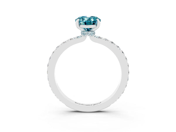 Platinum Oval Cut Blue Topaz Solitaire Engagement Ring with Pavé Band and Four-Prong Setting