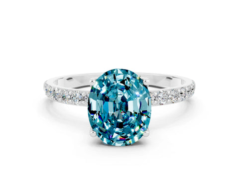 White gold Oval Cut Blue Topaz Solitaire Engagement Ring with Pavé Band and Prong Setting