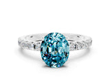 White gold Oval Cut Blue Topaz Solitaire Pavé Band with Four-Prong Setting