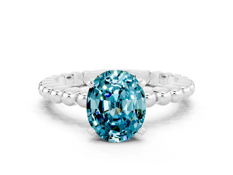 White gold Oval Cut Blue Topaz Solitaire Ring with Beaded Band and Prong Setting