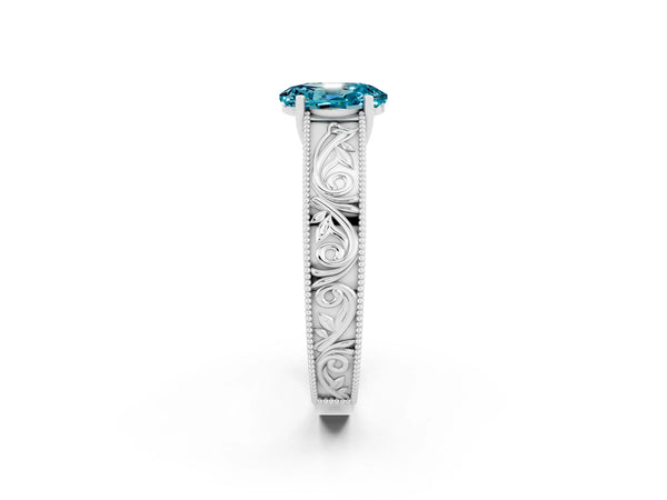 Silver Oval Cut Blue Topaz Solitaire Ring with Engraved Band and Four-Prong Setting