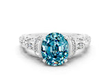 White gold Oval Cut Blue Topaz Solitaire Ring with Filigree Band and Four-Prong Setting_24
