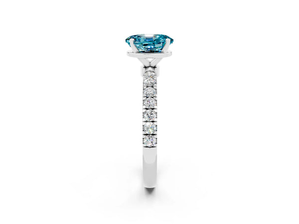 Platinum Oval Cut Blue Topaz Solitaire Ring with Pavé Accents and Four-Prong Setting