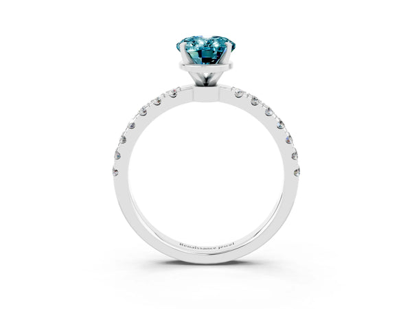 White gold Oval Cut Blue Topaz Solitaire Ring with Pavé Accents and Four-Prong Setting