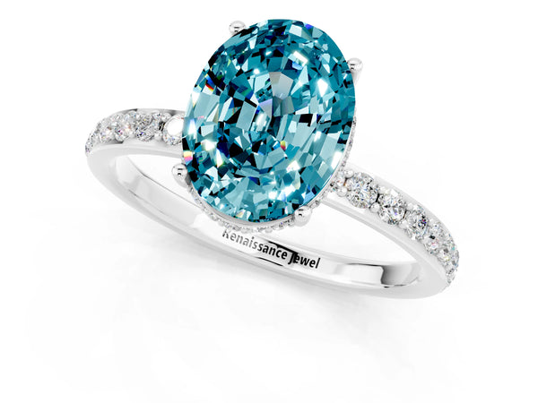 White gold Oval Cut Blue Topaz Solitaire Ring with Pavé Band and Hidden Halo