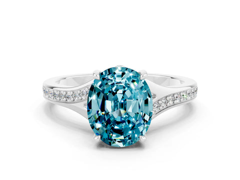 White gold Oval Cut Blue Topaz Solitaire Ring with Pavé Band and Prong Setting