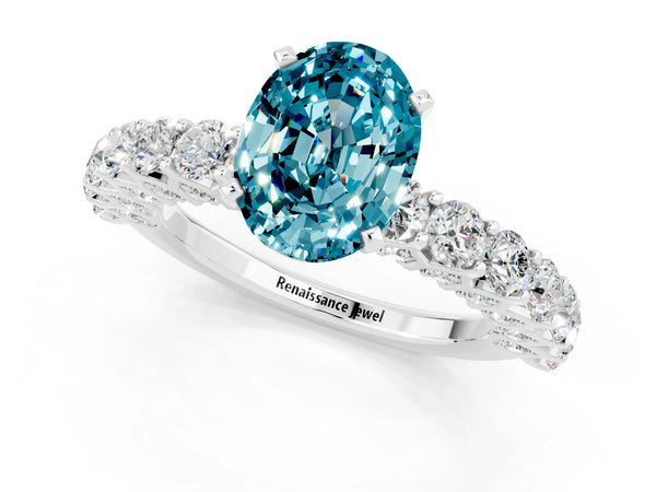 White gold Oval Cut Blue Topaz Solitaire Ring with Shared Prong Pavé Band and Four-Prong Setting