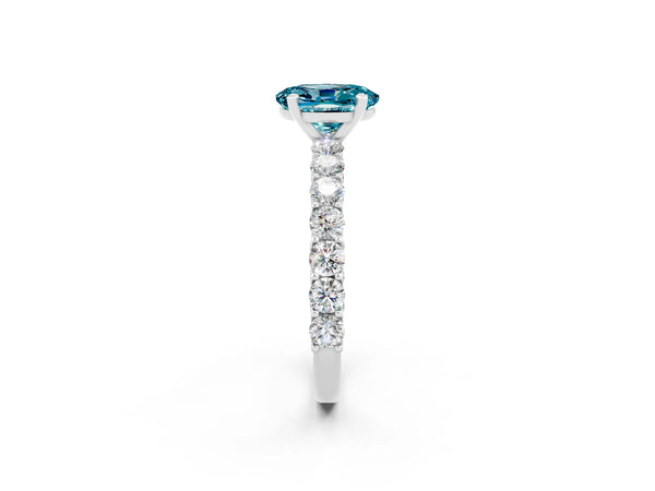 Silver Oval Cut Blue Topaz Solitaire Ring with Shared Prong Pavé Band and Four-Prong Setting