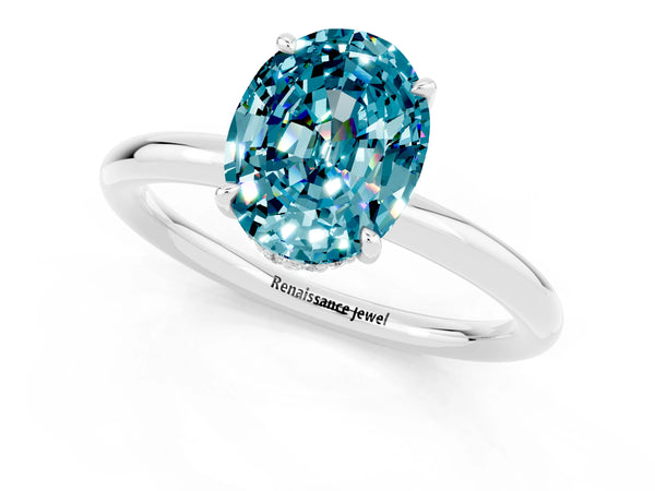 Platinum Oval Cut Blue Topaz Solitaire Ring with Thin Band and Four-Prong Setting