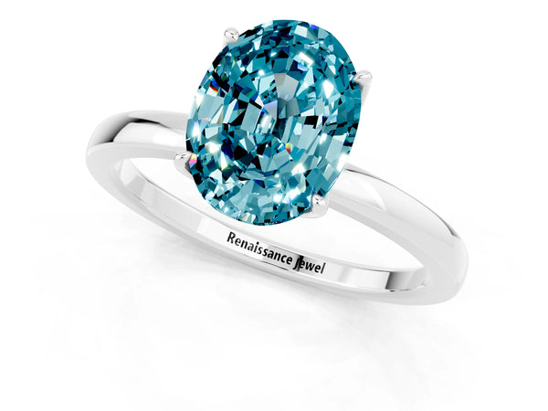 Platinum Oval Cut Blue Topaz Solitaire Ring with Thin Band and Prong Setting