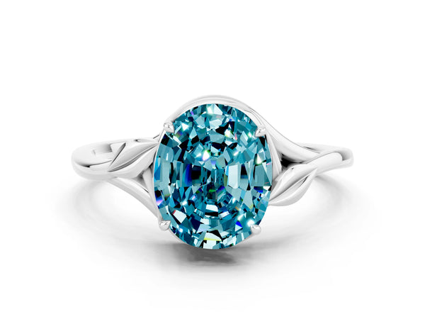 Silver Oval Cut Blue Topaz Solitaire Ring with Twist Band and Four-Prong Setting