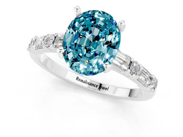 Platinum Oval Cut Blue Topaz Solitaire with Side Baguettes and Channel Set Band