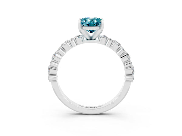 Platinum Oval Cut Blue Topaz Side Stone Solitaire Ring with Round  and Four-Prong Setting