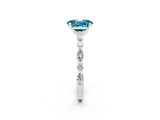 White gold Oval Cut Blue Topaz Solitaire with Side Stones on a Pavé Band and Four-Prong Setting_2