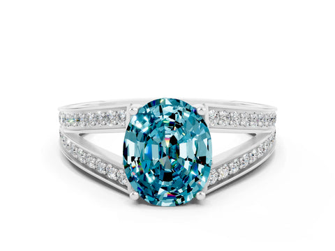 White gold Oval Cut Blue Topaz Split Shank Ring with Pavé Band and Four-Prong Setting