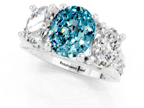 White gold Oval Cut Blue Topaz Three-Stone Ring with Channel Set Band and Four-Prong Setting_1