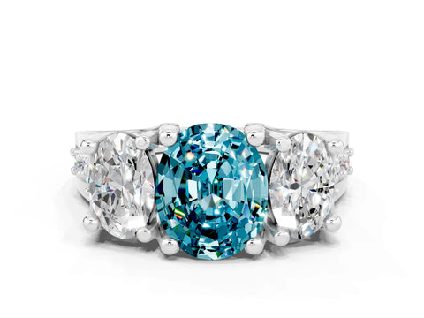 White gold Oval Cut Blue Topaz Three-Stone Ring with Channel Set Band and Four-Prong Setting