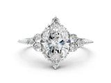 White gold Oval Cut Brilliant Diamond with Cluster Setting on a Beaded Band and Four-Prong Setting_270