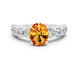 White gold Oval Cut Citrine Prong Setting with Side Stones on a Pave Band