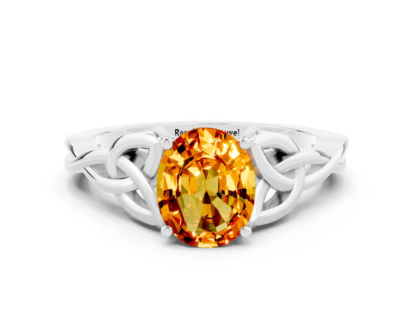 Silver Oval Cut Citrine Solitaire Celtic Knot Ring with Four-Prong Setting
