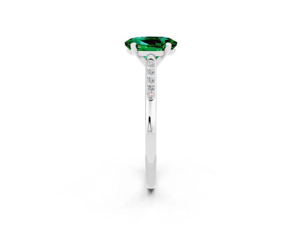 Platinum Oval Cut Emerald Solitaire Ring with Channel Set Round Band and Prong Setting