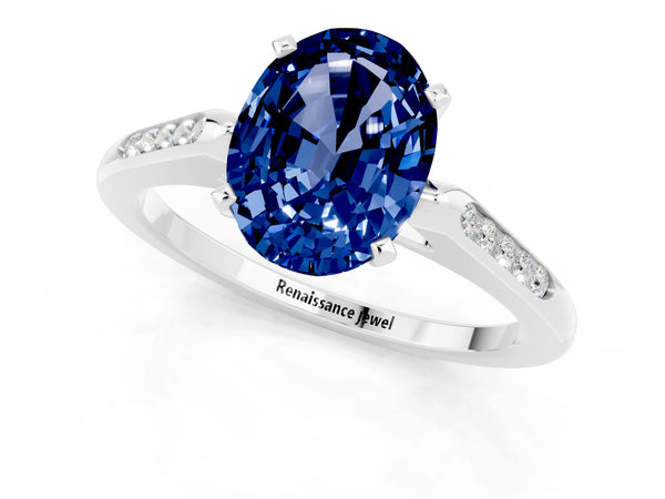 White gold Oval Cut Blue Sapphire Solitaire Ring with Channel Set Round Band and Prong Setting