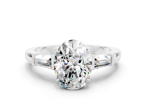 White gold Oval Cut Cut Diamond Ring with Tapered Baguette Side Stones in Four-Prong Setting