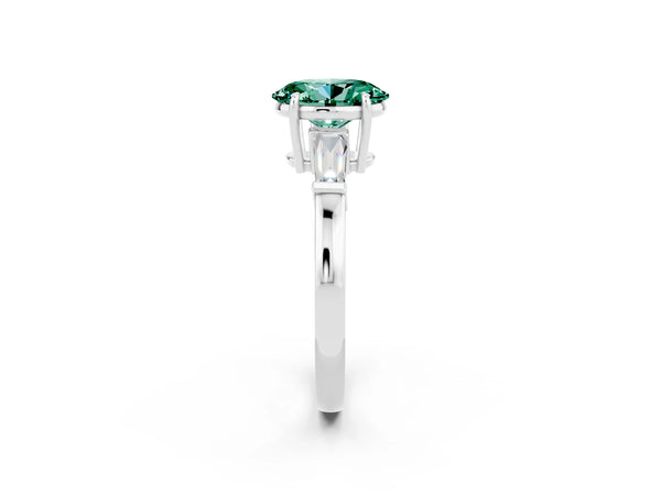 Silver Oval Cut Green Sapphire Three-Stone Ring with Tapered Baguette Side Stones and Prong Setting