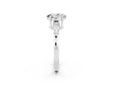 White gold Oval Cut Cut Diamond Ring with Tapered Baguette Side Stones in Four-Prong Setting_2