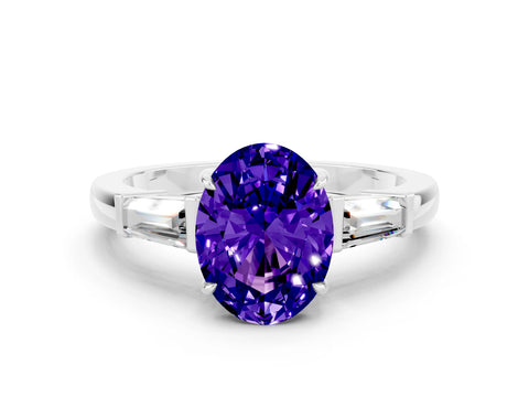 White gold Oval Cut Cut Diamond Ring with Tapered Baguette Side Stones in Four-Prong Setting