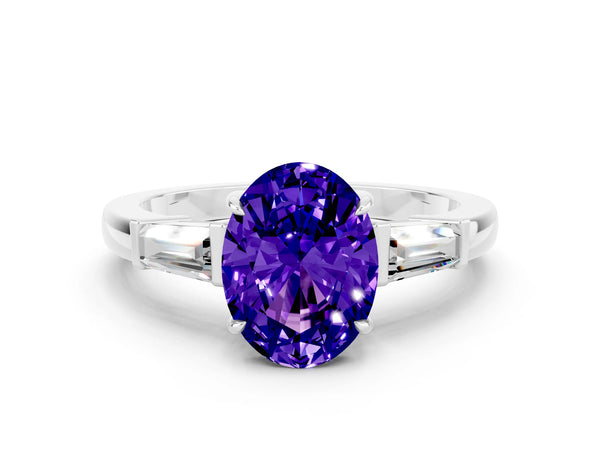 Platinum Oval Cut Tanzanite Three-Stone Ring with Tapered Baguette Side Stones and Prong Setting